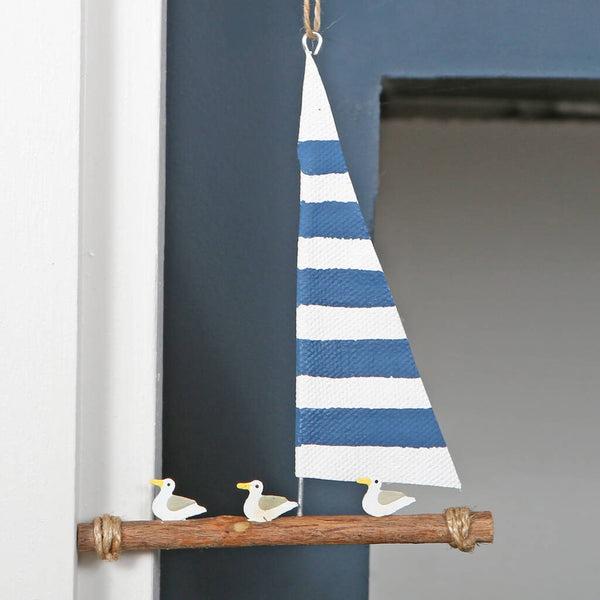 Seagulls On Raft With Blue And White Sail Decoration