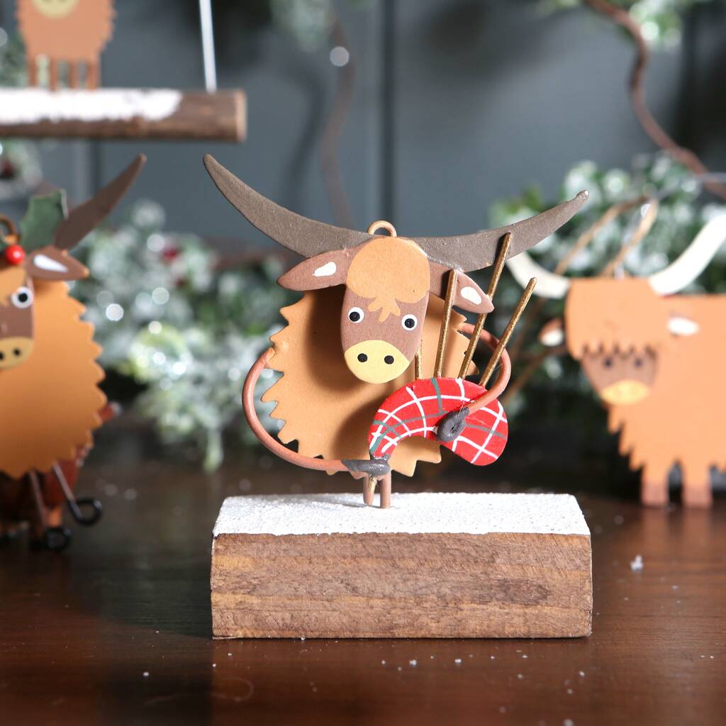 Christmas Highland Cow With Bagpipes On Block