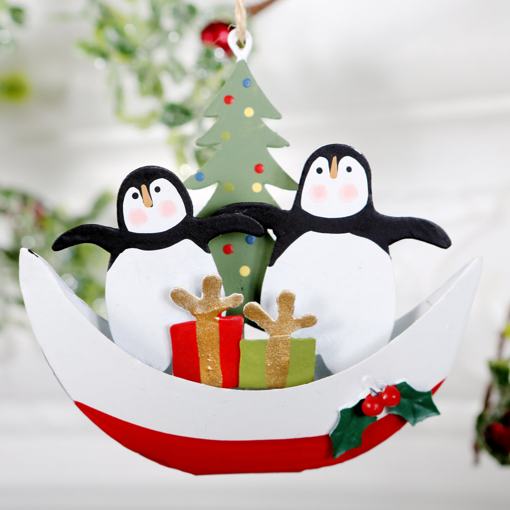 Two Happy Penguins In A Boat Christmas Tree Decoration